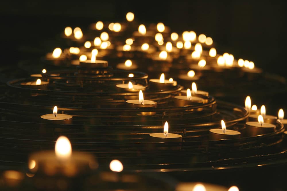 A line of candles lit in remembrance